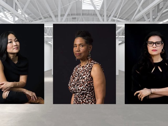 Three portrait photos of women artists on black backdrops, set against a bright white gallery interior with a skylit trussed ceiling