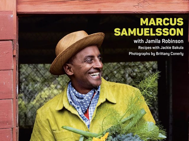 Chef Marcus Samuelsson smiling in a straw hat and yellow jacket, holding fresh fennel and greens, on his Back to Green book cover