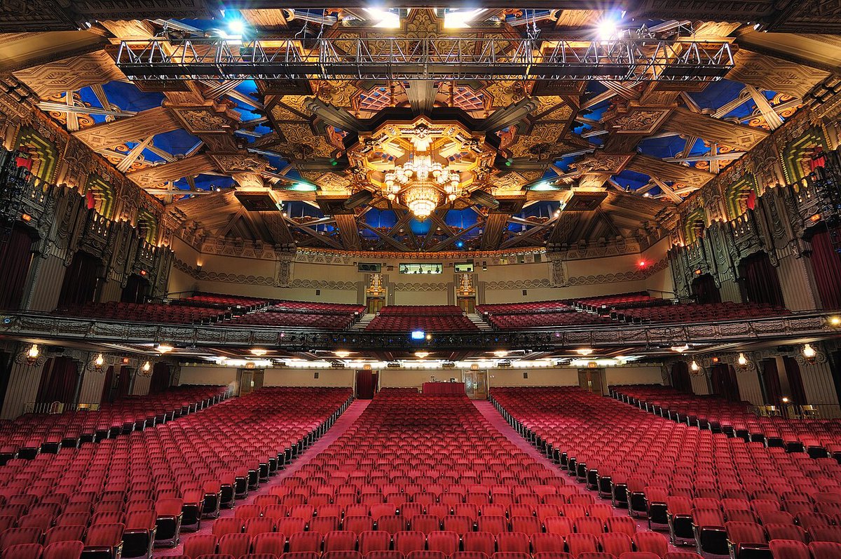 Red seats and the ornate Art Deco ceiling inside the Hollywood Pantages Theatre