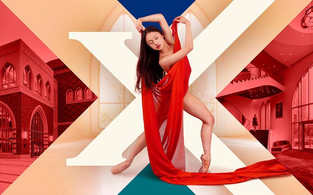 Dancer in a flowing red fabric posing in front of a large X with USC dance building interiors behind her