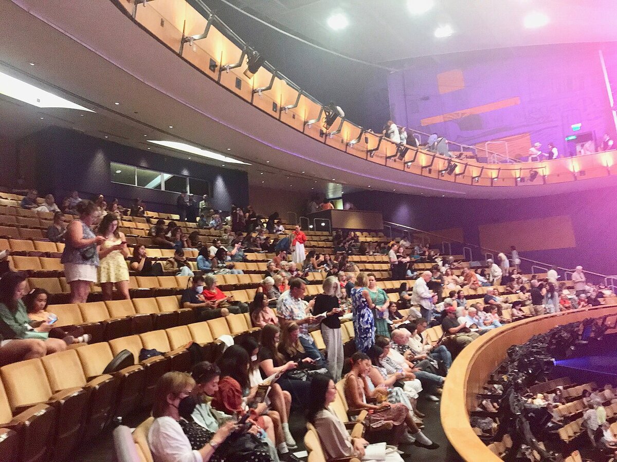 Audience gathering in the seats and balcony of the Ahmanson Theatre before a performance