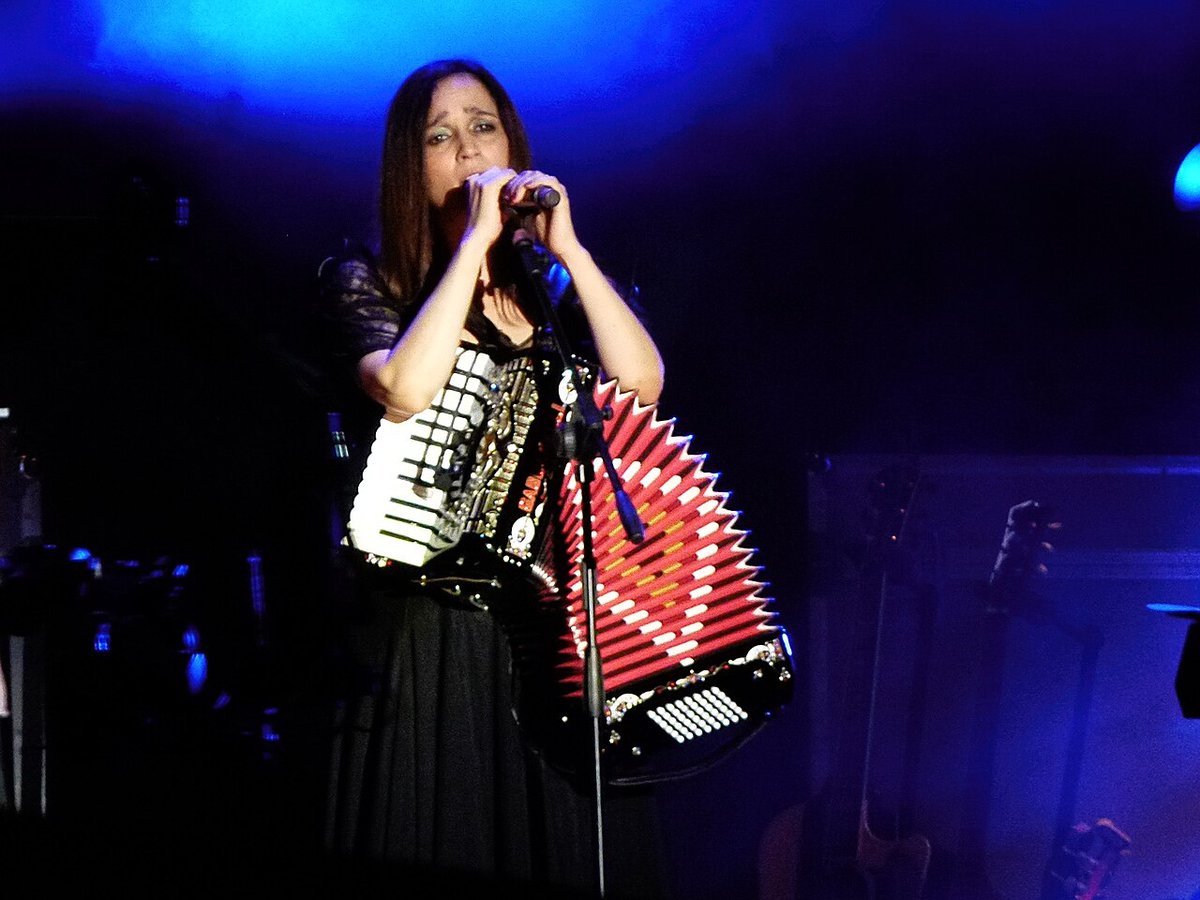 Julieta Venegas singing on an outdoor stage in Buenos Aires, the artist headlining The Wiltern on October 1