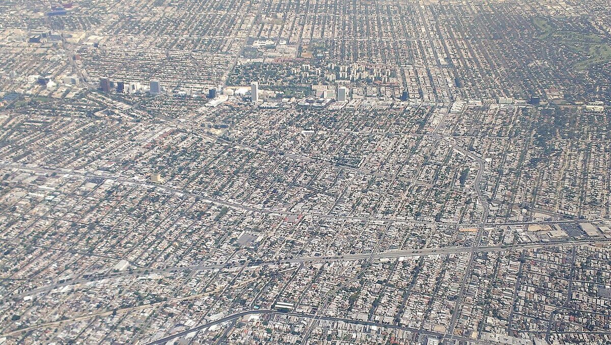 Aerial view of the Mid-Wilshire grid of Los Angeles streets with towers along Wilshire Boulevard