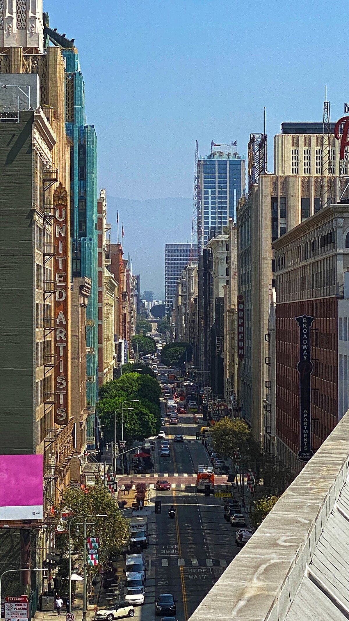 Downtown Los Angeles Broadway looking north, with the vertical United Artists theater sign on the left