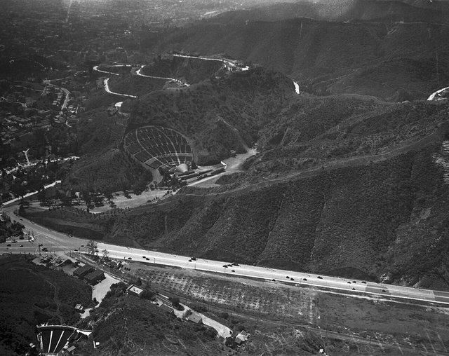Aerial black-and-white view of the Ford Amphitheatre in the Hollywood hills beside the Cahuenga Pass