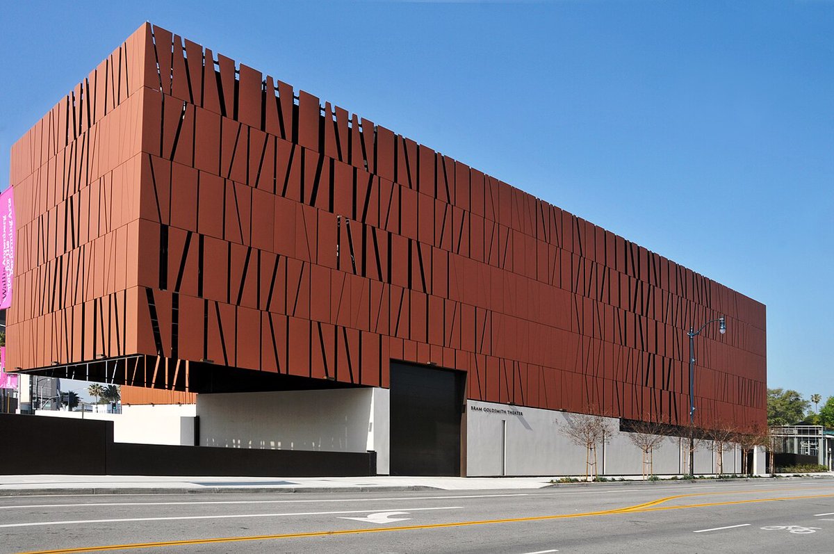The glass-fronted Wallis Annenberg Center for the Performing Arts seen from the street