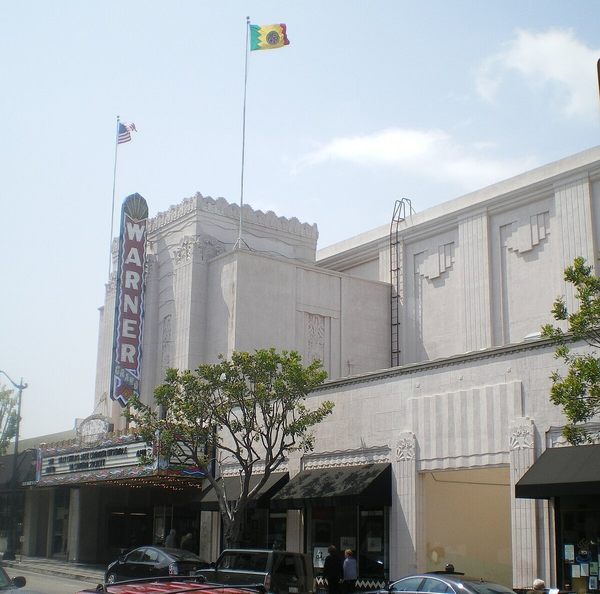 Art deco facade of the Warner Grand Theatre in San Pedro with its vertical neon sign and marquee