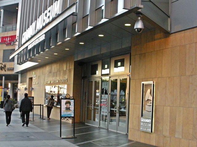 Street-level entrance of the GRAMMY Museum at L.A. Live with signage and a gramophone logo