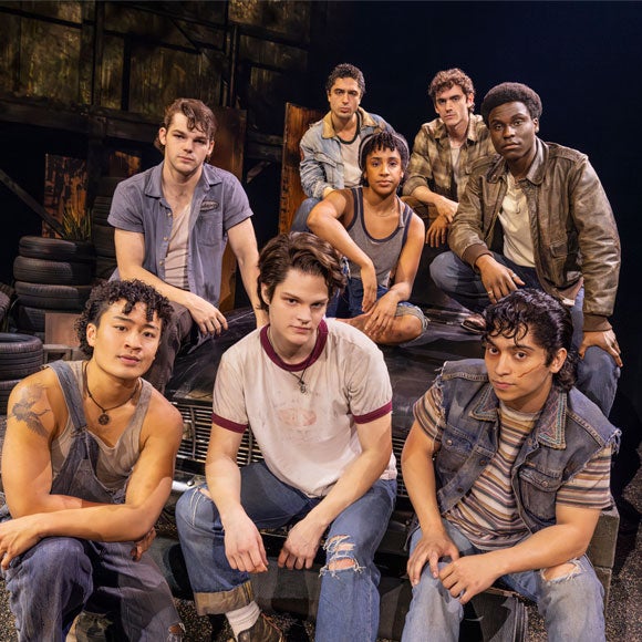 Scene from The Outsiders musical featuring cast members in 1960s Greaser jackets