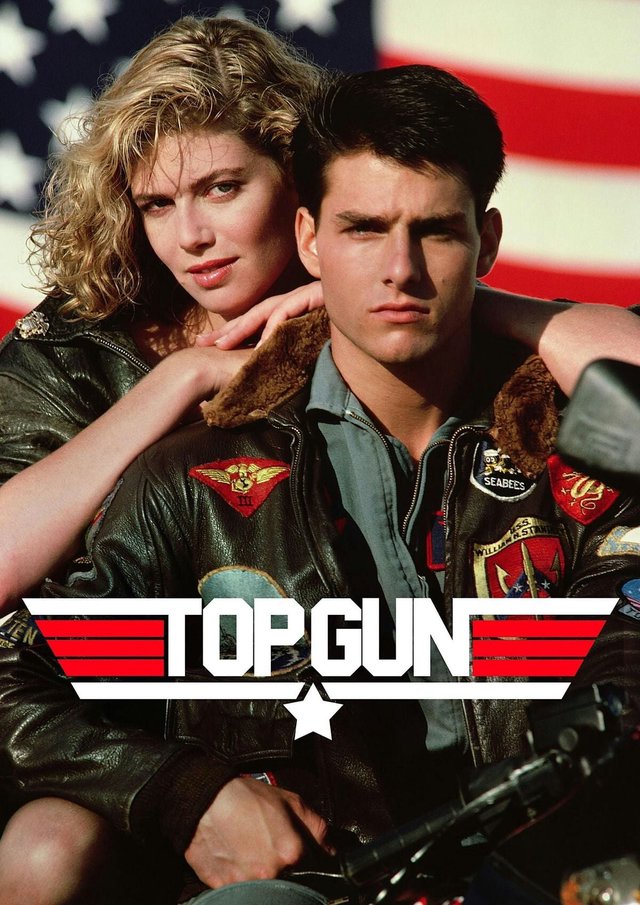 Top Gun movie poster showing a man in a flight jacket and a woman in front of an American flag