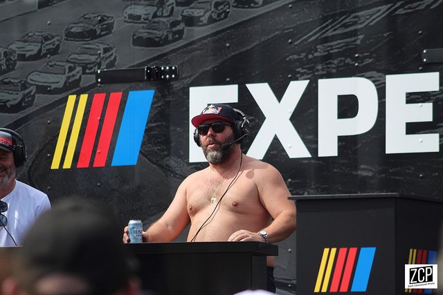 Bert Kreischer performing stand-up comedy on stage