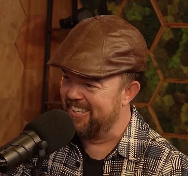 Brad Williams, stand-up comedian, laughing during a performance