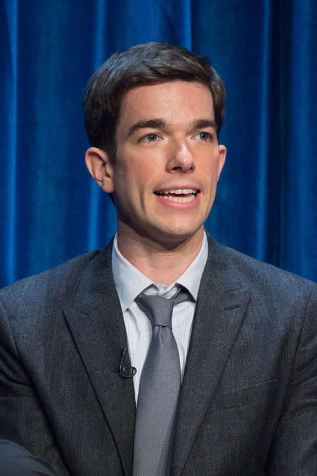 John Mulaney performing on stage at PaleyFest 2014