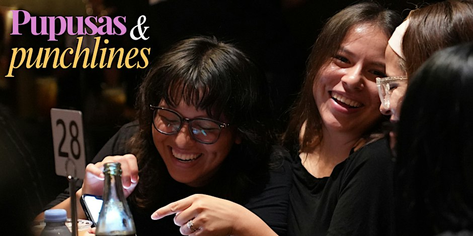 Audience members laughing at a restaurant table during Pupusas and Punchlines, with the show's purple and gold logo in the corner