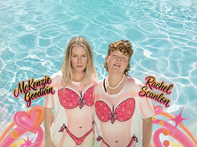 McKenzie Goodwin and Rachel Scanlon standing in a pool in matching bikini-print shirts, with their names in airbrush lettering