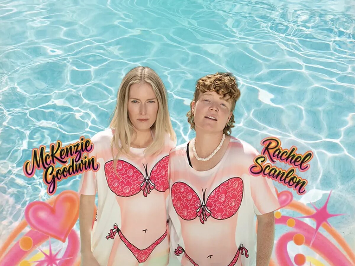 McKenzie Goodwin and Rachel Scanlon standing in a pool in matching bikini-print shirts, with their names in airbrush lettering