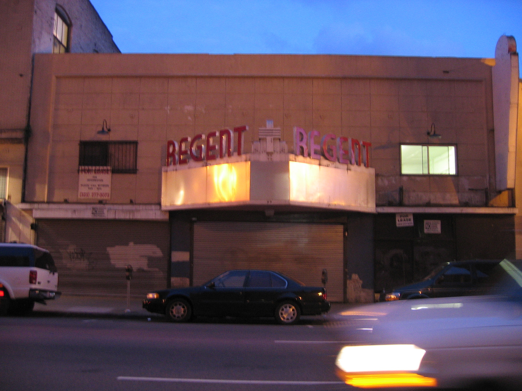 The Regent Theater marquee and red REGENT lettering on South Main Street at dusk