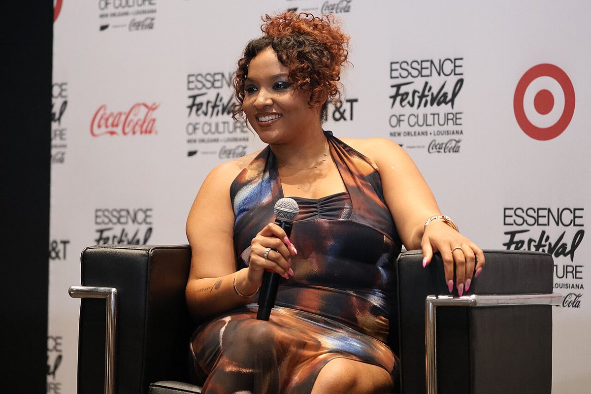 Alex Isley smiling backstage at Essence Fest 2025