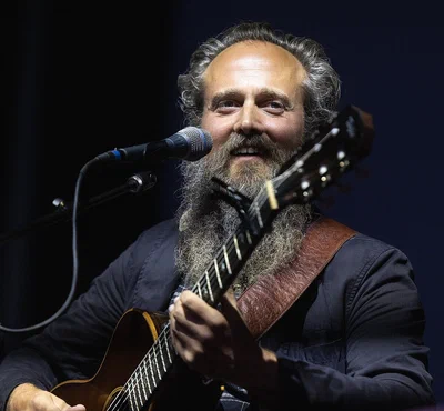 Photo of Iron & Wine performing on stage