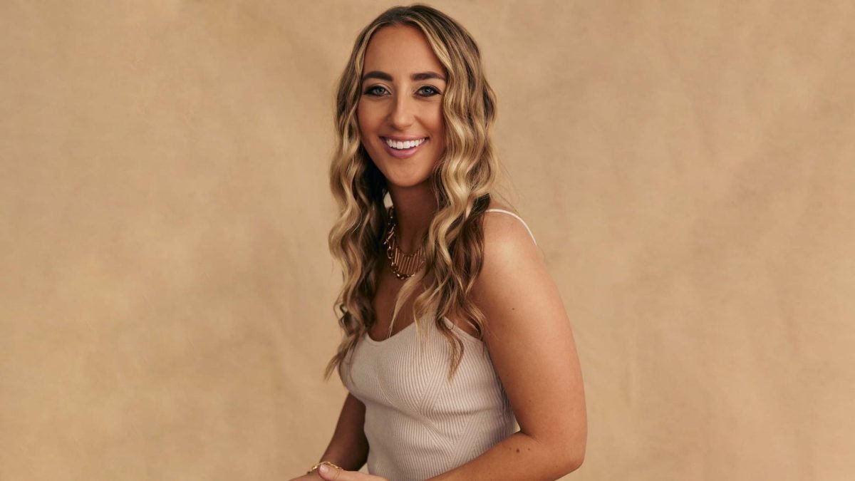 Ashley Cooke posed in a denim jacket for a promotional tour photo