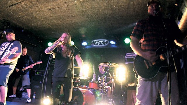 Close Your Eyes performing live on stage, guitarist and vocalist energizing the crowd