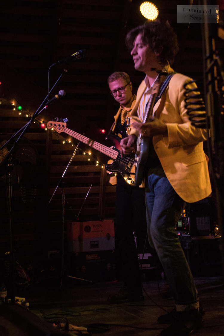Deer Tick performing live on stage with guitars under stage lights