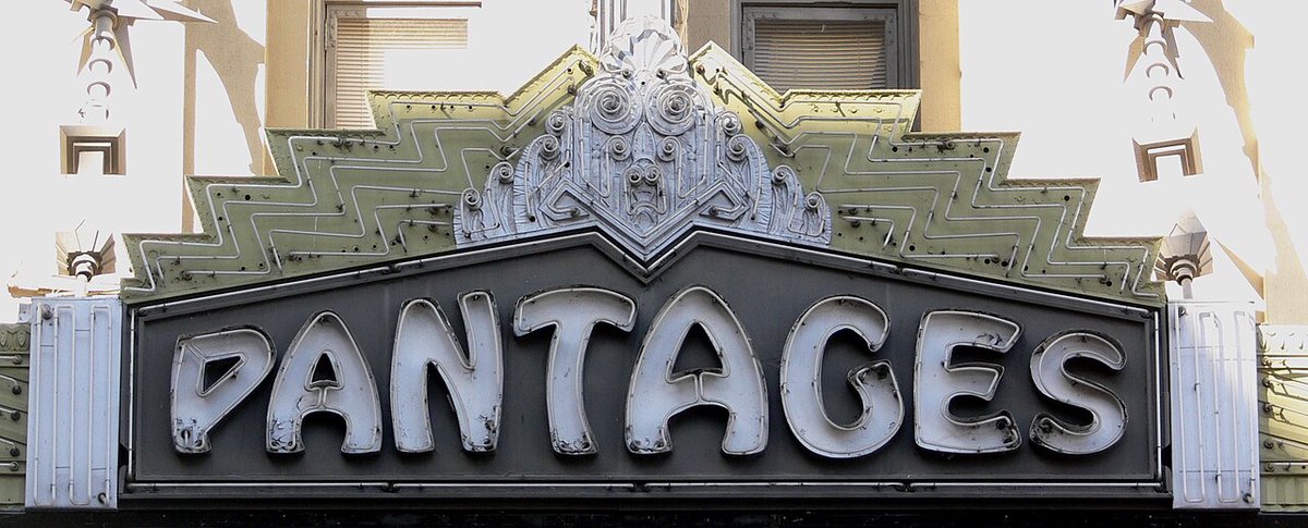 The ornate neon PANTAGES sign above the Hollywood Pantages Theatre entrance on Hollywood Boulevard
