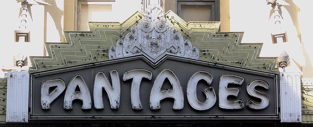 The ornate neon PANTAGES sign above the Hollywood Pantages Theatre entrance on Hollywood Boulevard