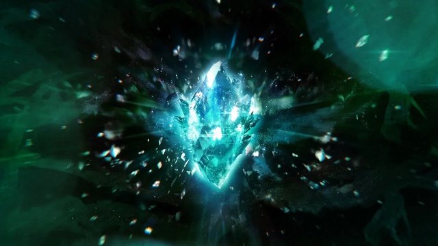 Glowing teal crystal bursting into shards against a dark green background, key art for the Final Fantasy 40th anniversary concert
