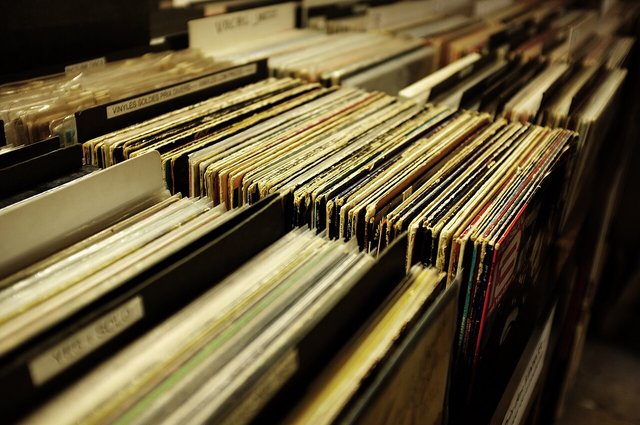 Crates of vinyl records packed tightly in a record store bin