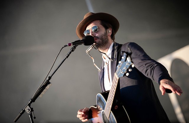 Lord Huron performing on an outdoor festival stage