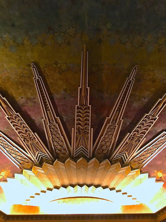 The gilded Art Deco sunburst ceiling detail inside the Wiltern theatre