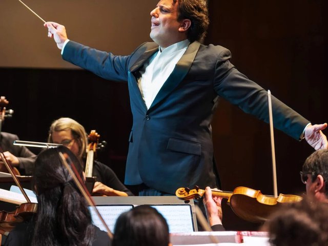 Orchestra Santa Monica conductor leading the orchestra during a concert