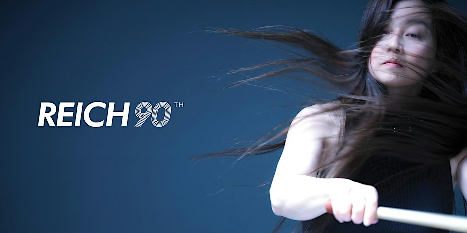 Kuniko Kato mid-motion with a mallet, hair flying, beside the REICH90 logo on a deep blue backdrop