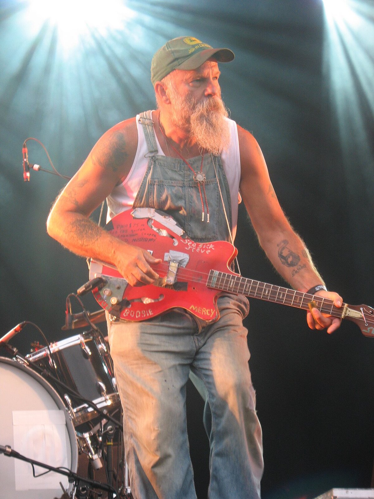 Seasick Steve playing a resonator guitar on stage