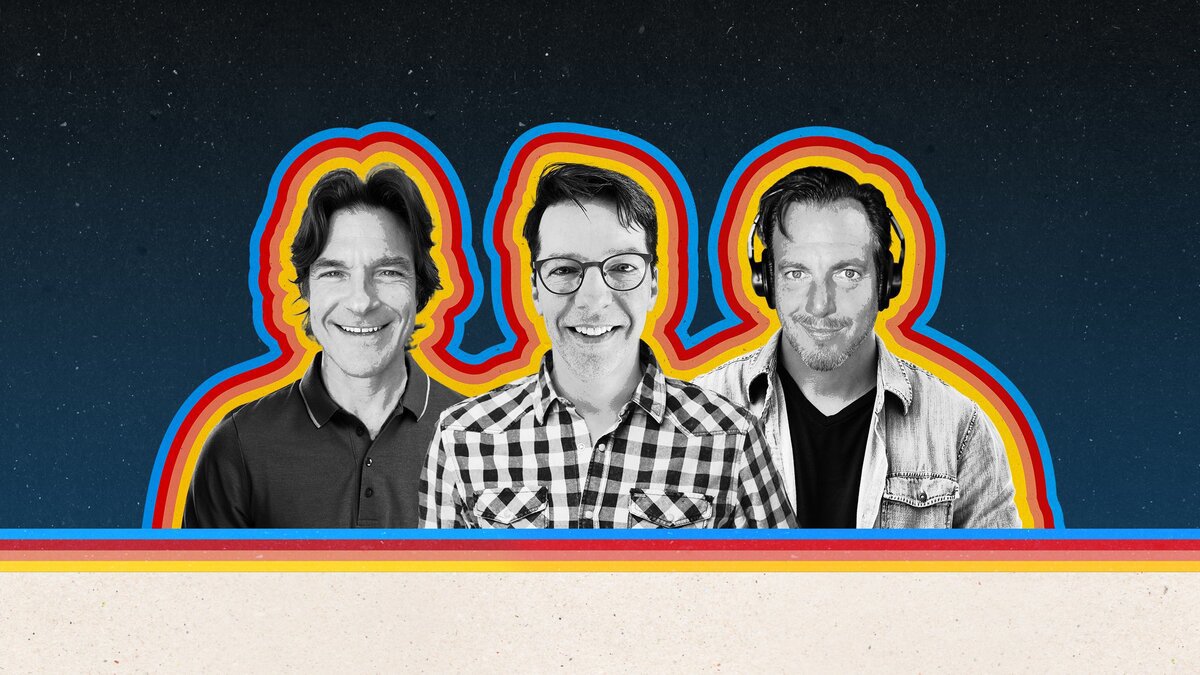 Black and white portraits of three men outlined in blue, red and yellow stripes on a starry navy background