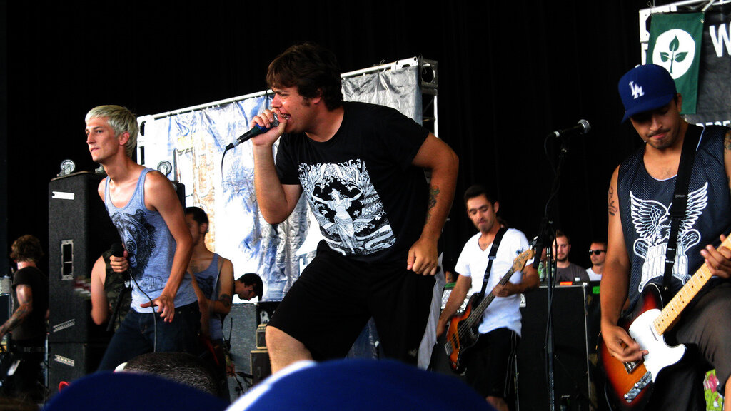 Set Your Goals vocalists and guitarist performing on an outdoor stage at Warped Tour 2008