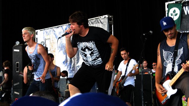 Set Your Goals vocalists and guitarist performing on an outdoor stage at Warped Tour 2008