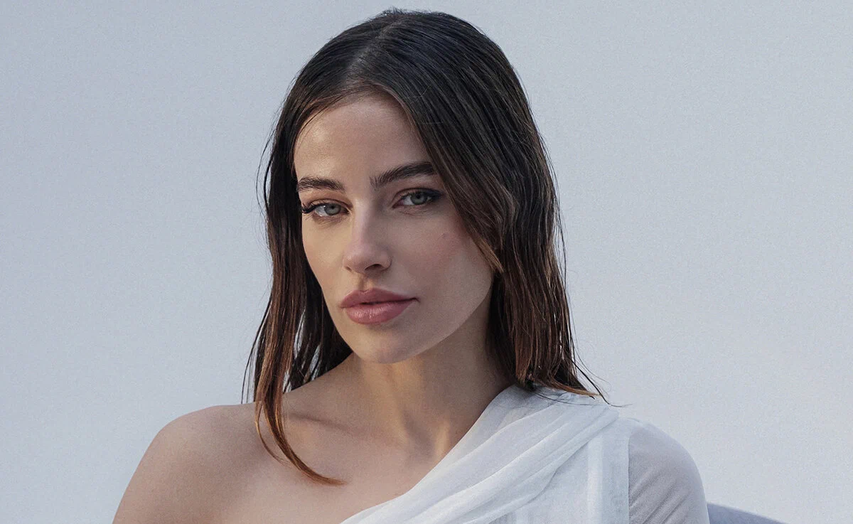 Anfisa Letyago in a close promo portrait wearing a white draped top