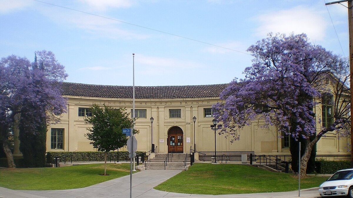 Lincoln Heights Branch Library with jacaranda trees in bloom, a landmark in the neighborhood around The Airliner