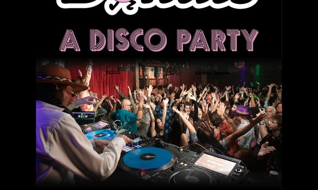 Crowd with raised hands on the dance floor at a disco night, a DJ in a brown hat at blue turntables in the foreground, red curtains behind