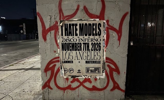 I Hate Models Disco Inferno flyer pasted on a concrete wall with red painted designs, reading November 7th, 2026, Los Angeles, Lammer and Materielle