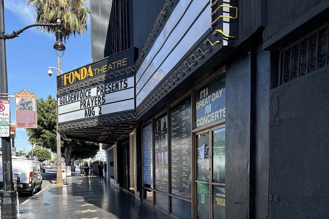 The Fonda Theatre marquee on Hollywood Boulevard, with Walk of Fame stars on the sidewalk out front