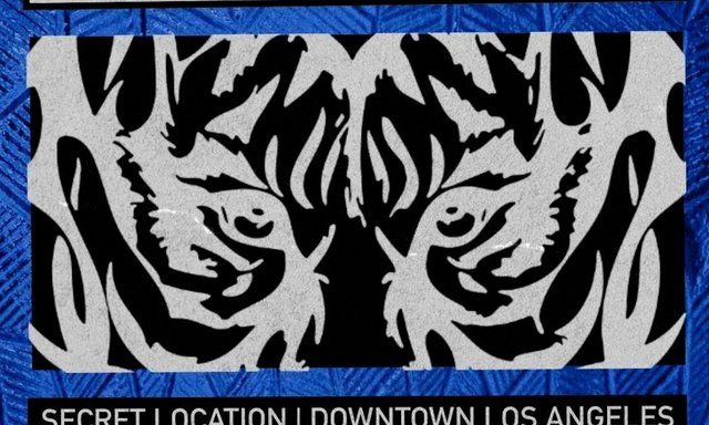 Event flyer with a black and white tiger-eyes graphic on a blue textured background and the words Secret Location, Downtown, Los Angeles
