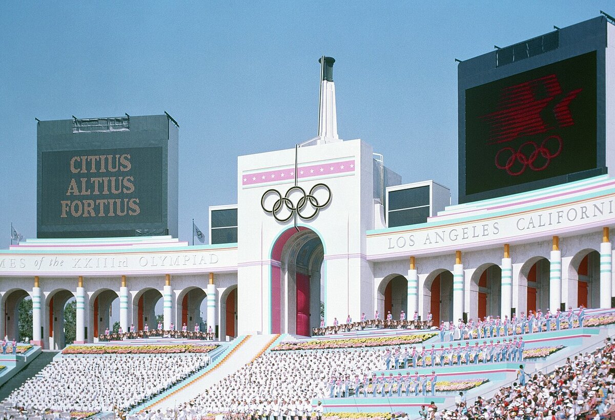 The peristyle end of the Los Angeles Memorial Coliseum with its Olympic rings and torch tower, photographed during the 1984 Olympics