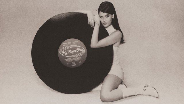 Black-and-white tour art of Sienna Spiro kneeling beside a giant vinyl record whose label reads My House Tour