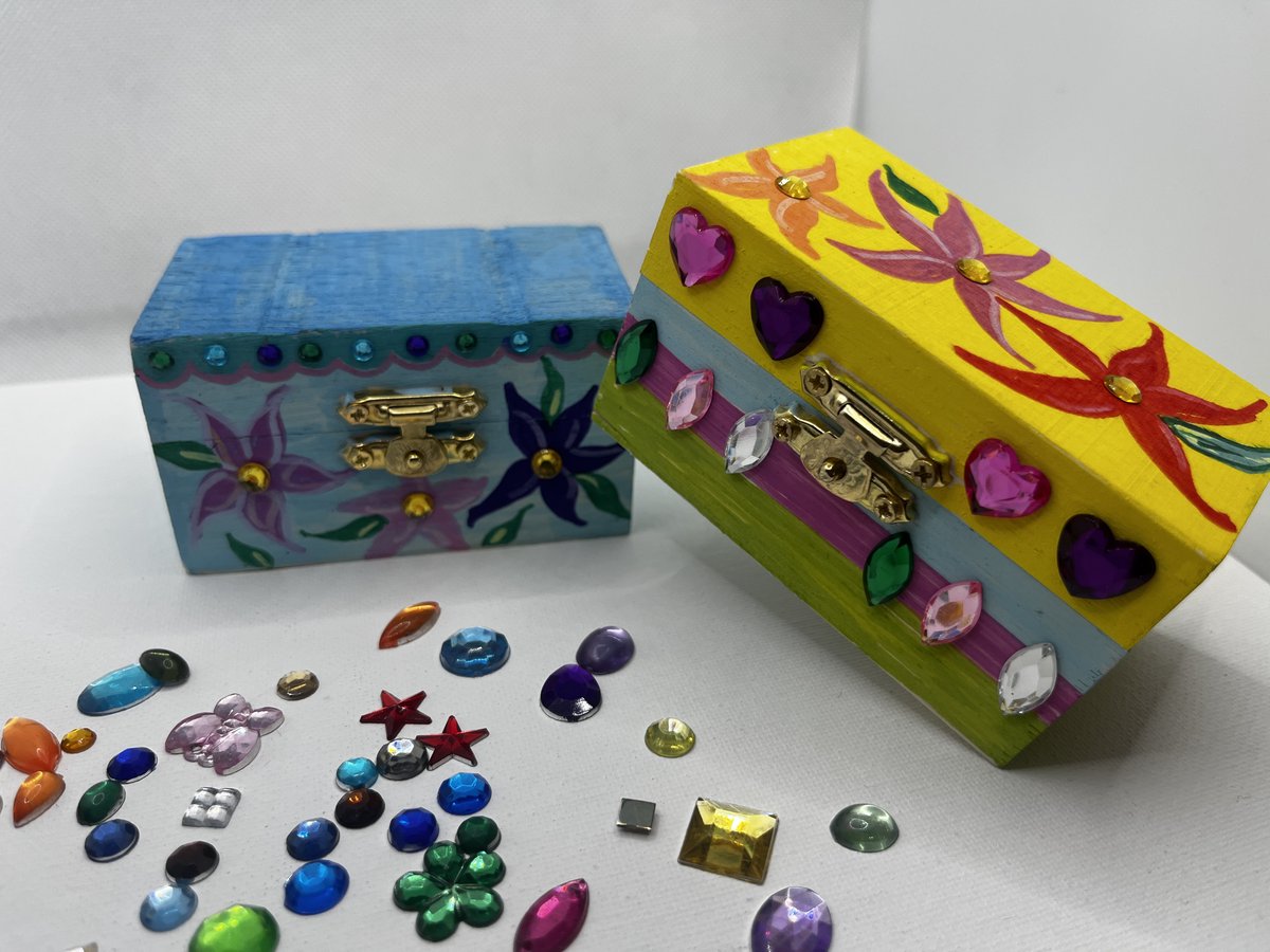 A hand-painted wooden mini treasure chest decorated with folk-art style patterns