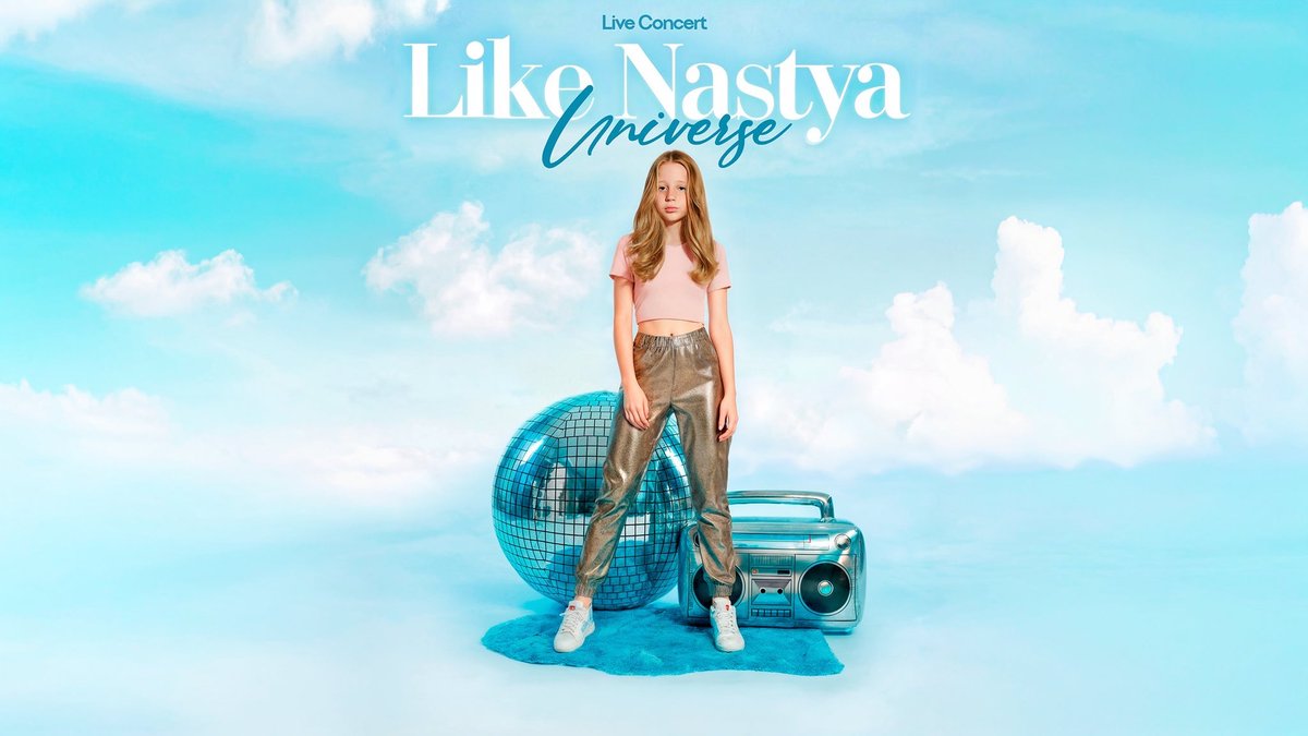 Like Nastya in a pink top and metallic silver pants standing in front of a mirror ball and a silver boombox against a sky blue cloud backdrop, under the Like Nastya Universe live concert title