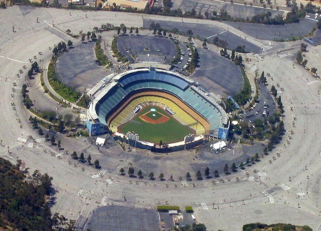 Aerial view of Dodger Stadium surrounded by its large parking lots