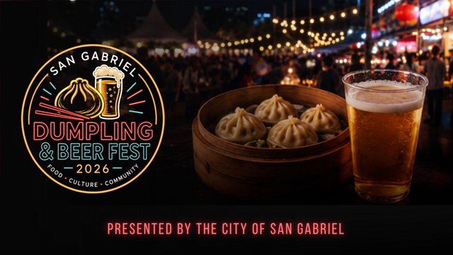 Festival crowd gathered around food and beer vendor stalls at an outdoor evening event